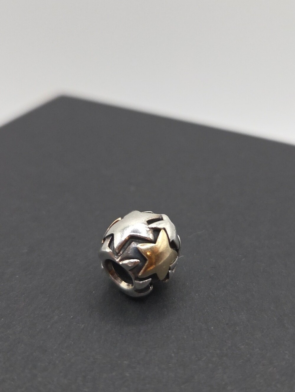 Pandora Retired "Golden Star" Charm in Sterling Silver and 14KT Gold.